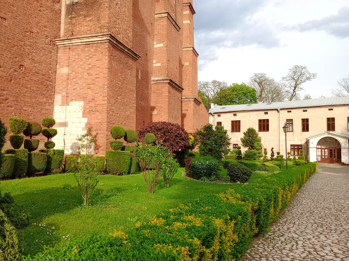 Garden beside the brick convent wall at Poor Clares’ convent, Kraków