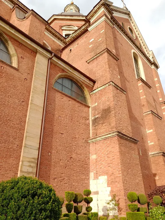 High brick wall above the clipped planting at Poor Clares’ convent, Kraków