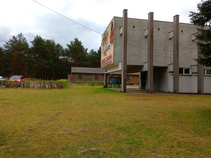The museum building across the lawn at Prisoner-of-War Camps Museum, Żagań