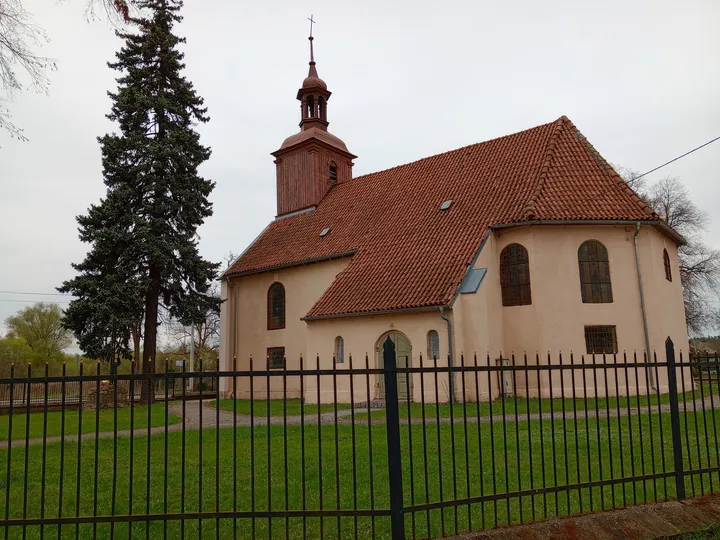 Village church beside its fenced grounds at Przetocznica cycling route