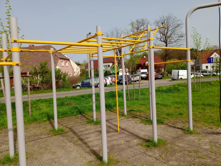 Multiple stations near the fence at Przylep outdoor exercise ground
