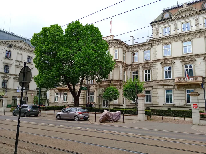 Upper storeys above the passing tram at Puget Palace