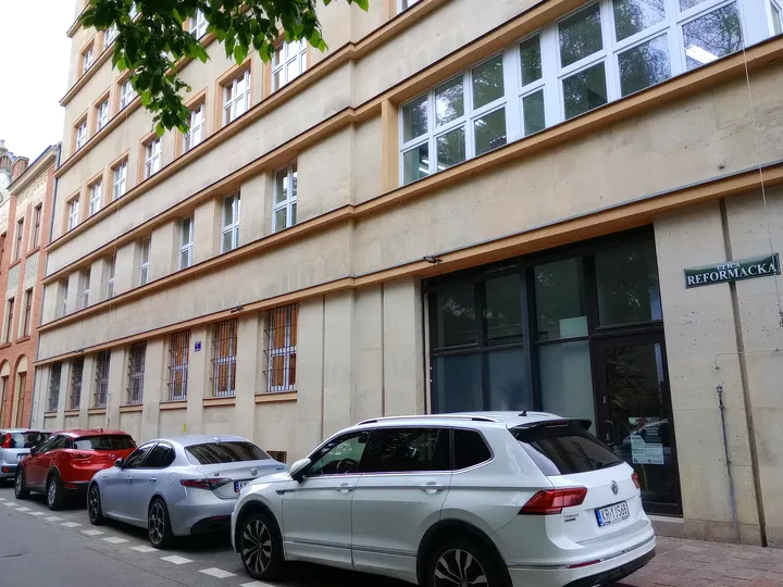 Townhouse façades along the narrow street at Reformacka Street