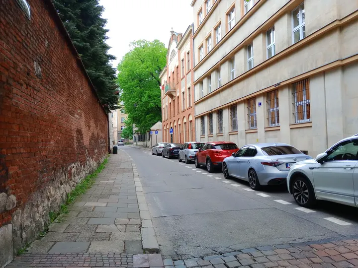 The lane beside an old brick wall at Reformacka Street