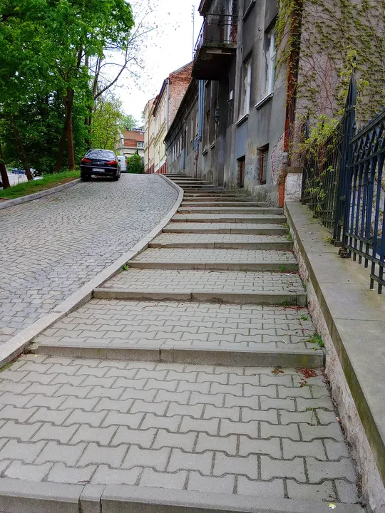 Steps beside a high retaining wall at Rękawka hillside