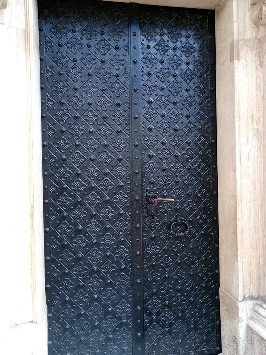 Grille across a church window at Saint Andrew’s Church, Kraków
