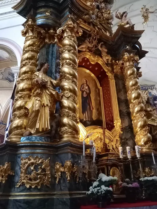 Carved figures beside the altar at Saint Bernardine of Siena Church