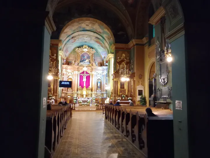 Lit altar at the end of the nave at Saint Casimir’s Church, Kraków