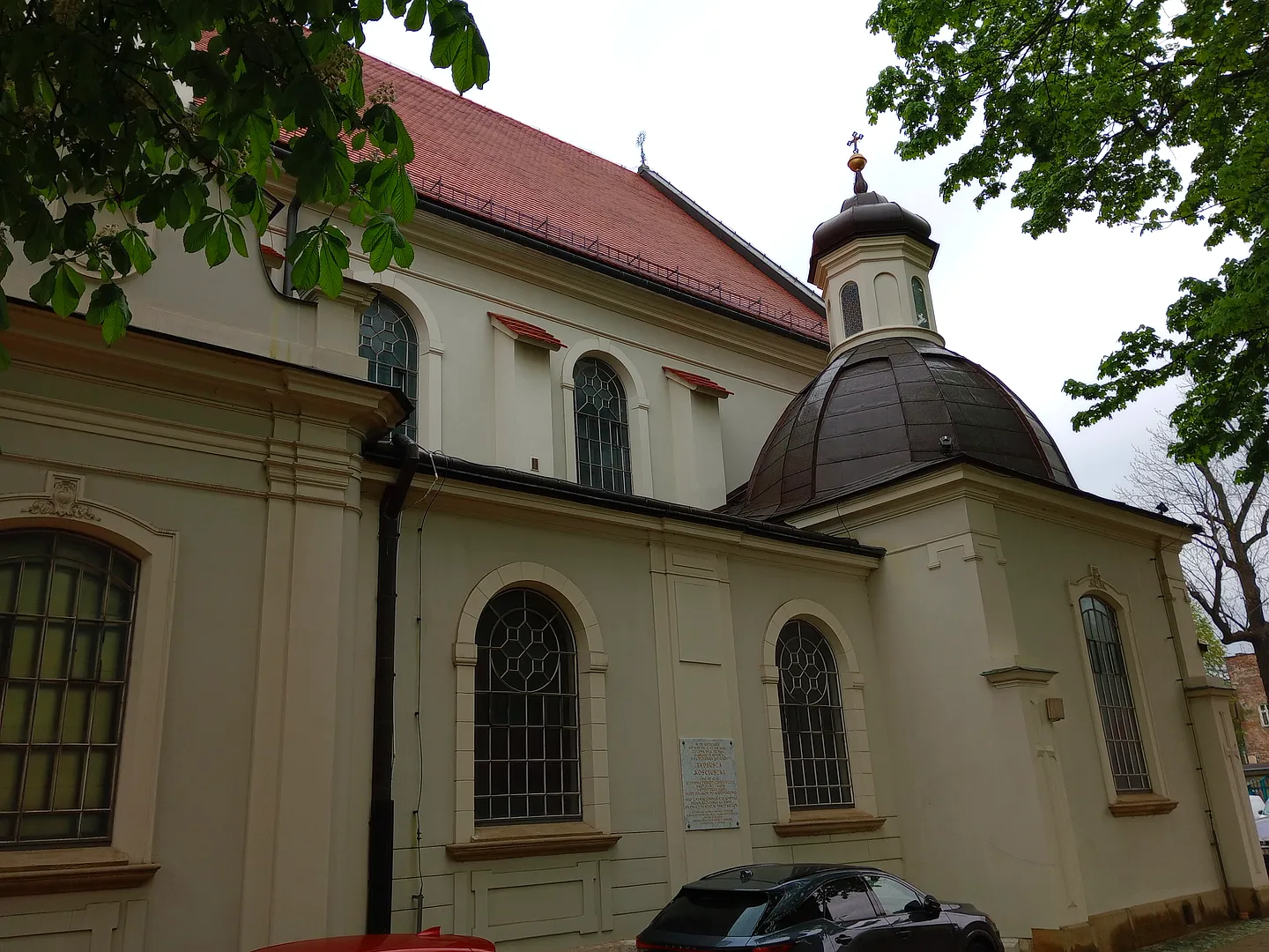 Pale church walls and a small domed chapel at Saint Florian’s Church, Kraków