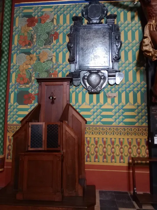 A painted wall beside the pews at Saint Francis of Assisi Basilica, Kraków