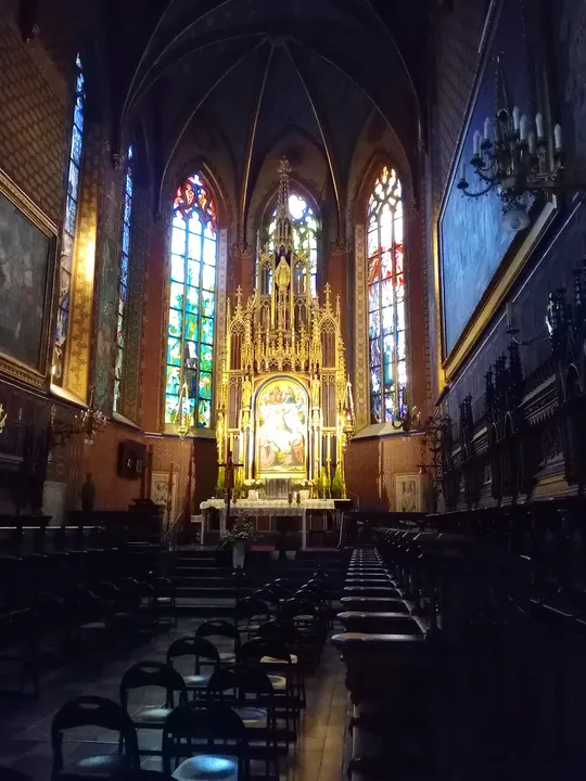 Tall stained-glass windows above the nave at Saint Francis of Assisi Basilica, Kraków