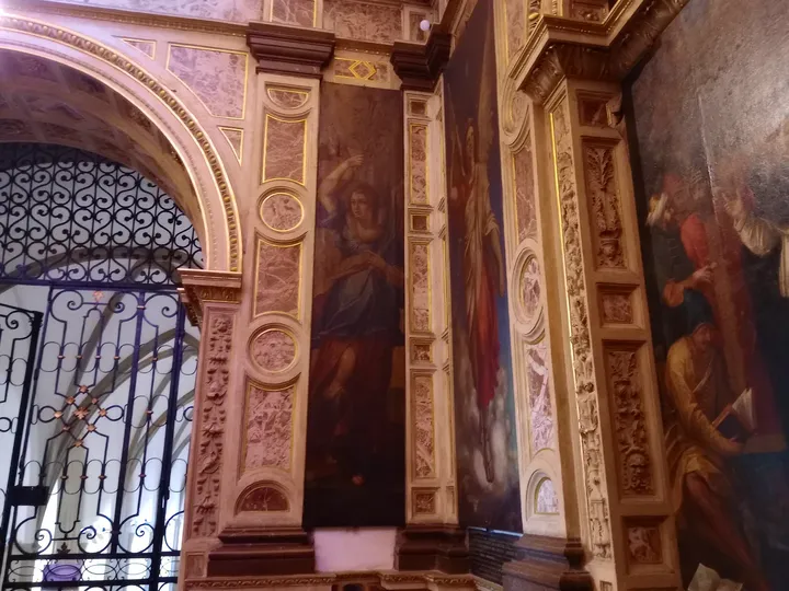 Paintings beside an interior doorway at Saint Hyacinth’s shrine