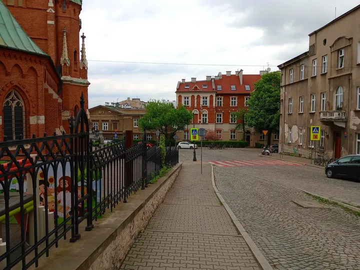 The street beyond the boundary railings at Saint Joseph’s Church, Podgórze