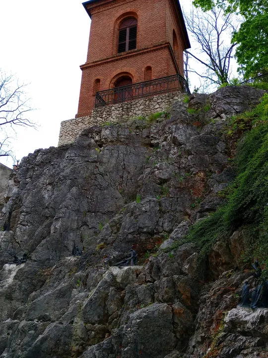 The church tower above the rocky base at Saint Joseph’s Church, Podgórze
