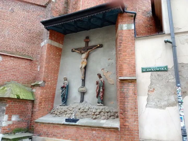 Crucifixion group on the exterior wall at Saint Mark’s Church, Kraków