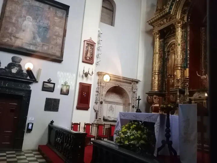 Memorials and pictures beside the altar at Saint Mark’s Church, Kraków