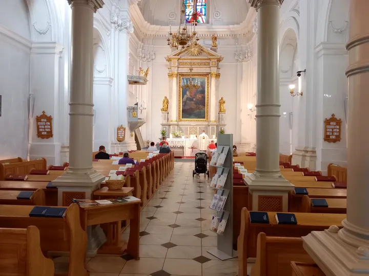 The altar beyond the tiled aisle at Saint Martin’s Church, Kraków