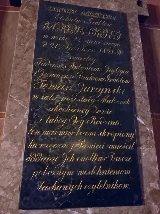 An inscribed memorial tablet at Saint Mary’s Basilica, Kraków