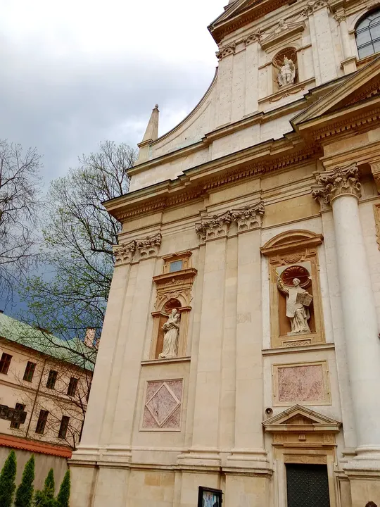 Stone figures and the entrance façade at Saints Peter and Paul Church, Kraków