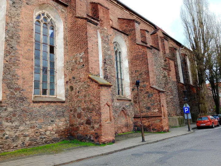 Church wall beside the pavement at Saints Peter and Paul Church, Żagań