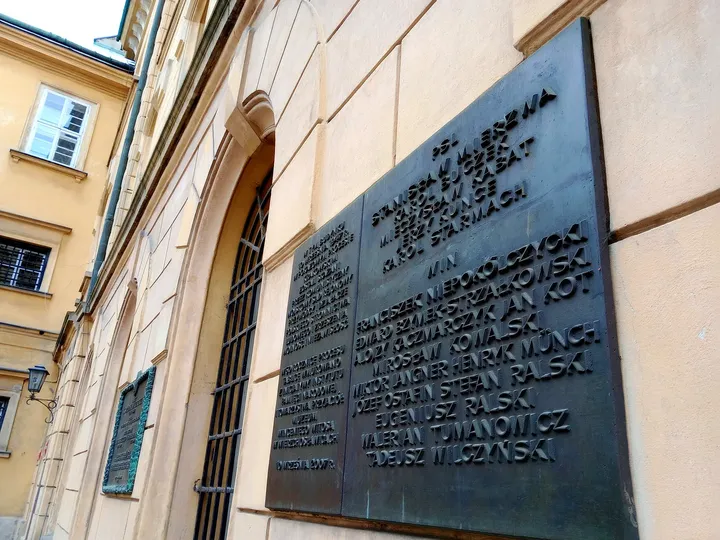 The narrow street above a memorial plaque at Senacka Street