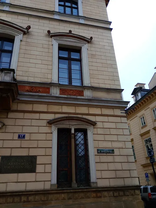 Window surrounds on a pale frontage at Sławkowska Street