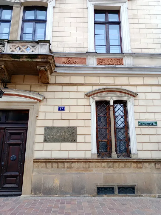 Balcony above a timber entrance at Sławkowska Street