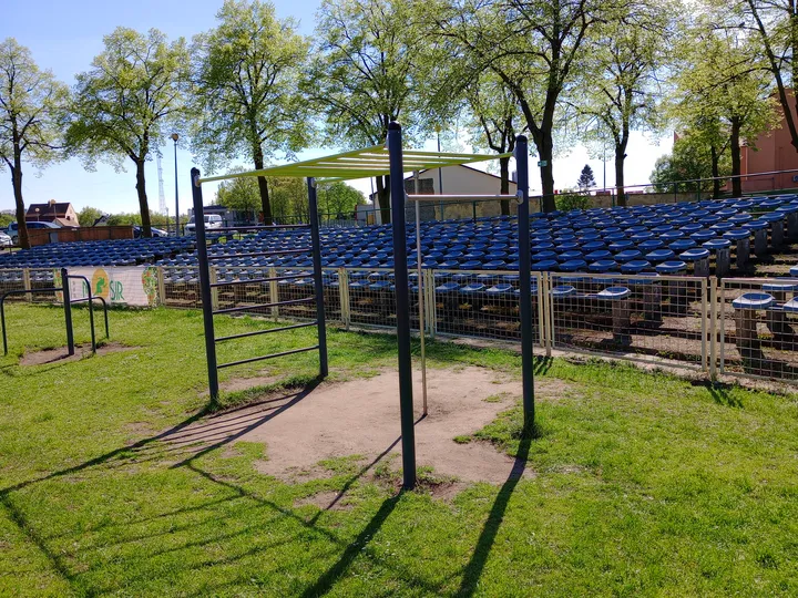 Tall bars above the equipment surface at Sulechowska stadium outdoor exercise ground