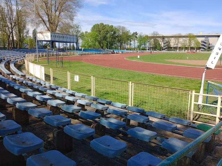 Curved seating rows facing the field at Sulechowska stadium outdoor exercise ground