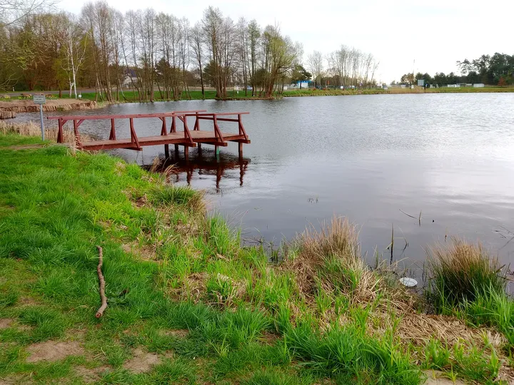 Wooden landing beside the bank at Świdnica reservoir