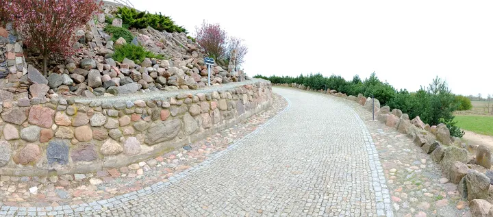 A paved route alongside the landscaped ground at Świebodzin town walk