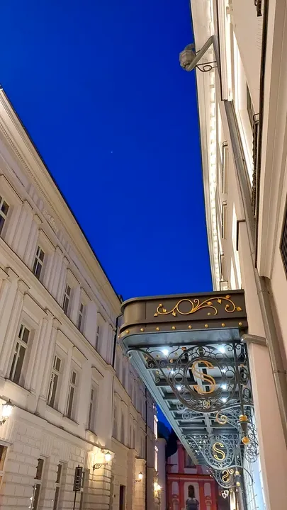 Glass entrance canopy after dark at Świętego Tomasza Street