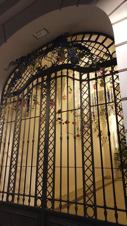 Old grille across a stone portal at Świętego Tomasza Street