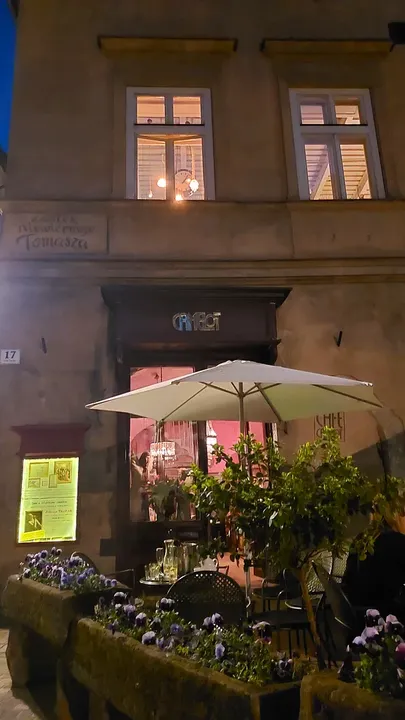Pink shopfront after dark at Świętego Tomasza Street