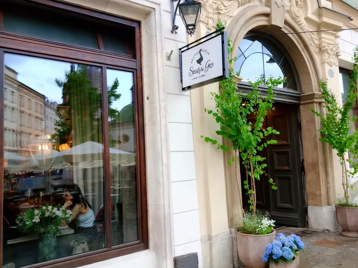 Restaurant window and street frontage at Szara Gęś