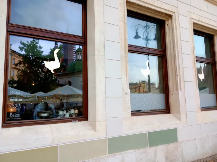 Window overlooking the pavement at Szara Gęś