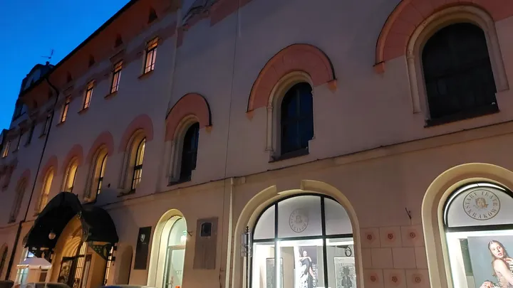 Arched openings in a rounded façade at Szczepański Square