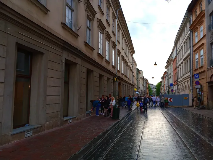 Older façades beside the paved lane at Szewska Street