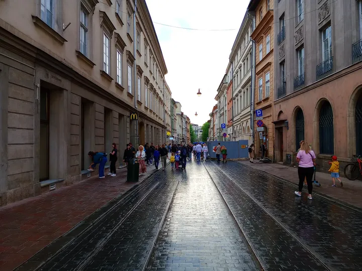 The wet street leading towards the square at Szewska Street