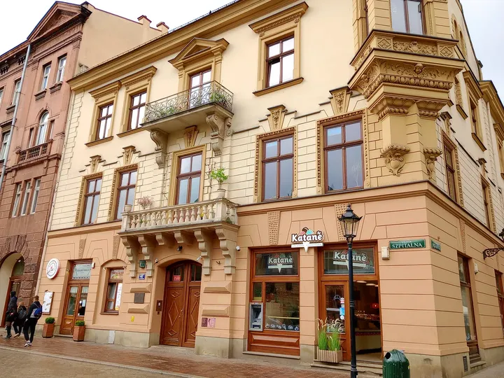 Carved details above the lower windows at Szpitalna Street
