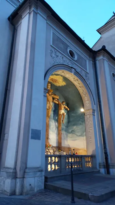 A devotional figure in an exterior niche at Visitation Church, Kraków