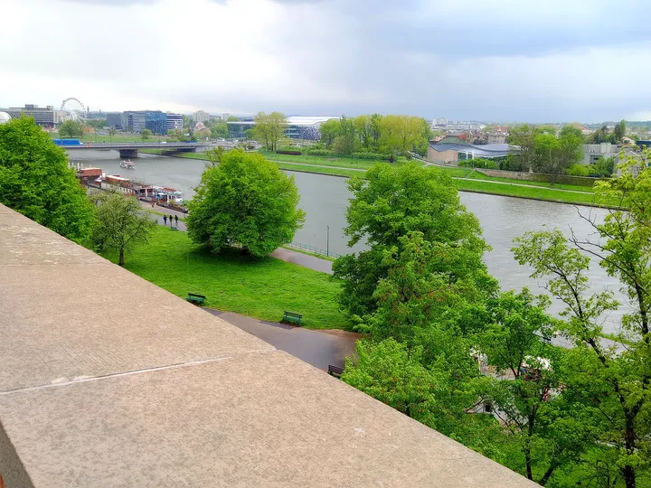 The river and its banks open out below the hill on Wawel Hill in Kraków