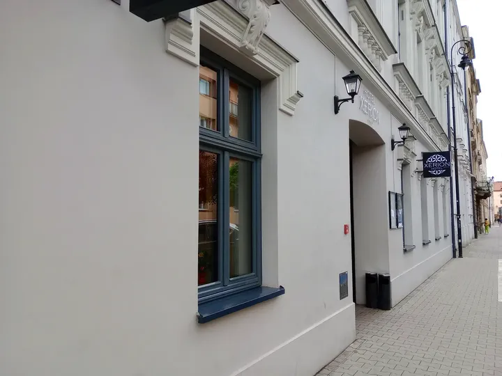 The street beside a pale building at Węgierska Street