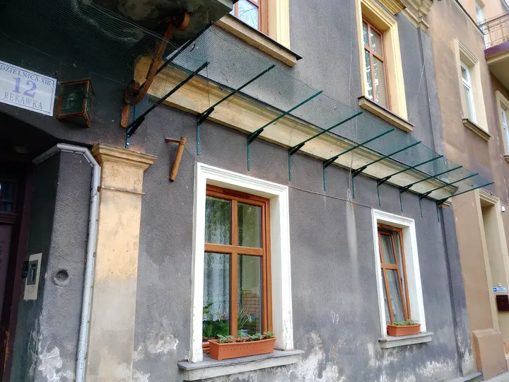A history panel mounted beside the street at Węgierska Street