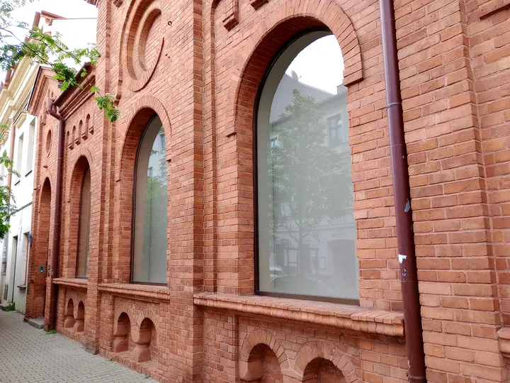 Arched windows in the brick wall at Węgierska Street