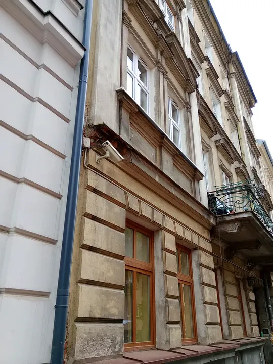 Older façades along the roadway at Węgierska Street
