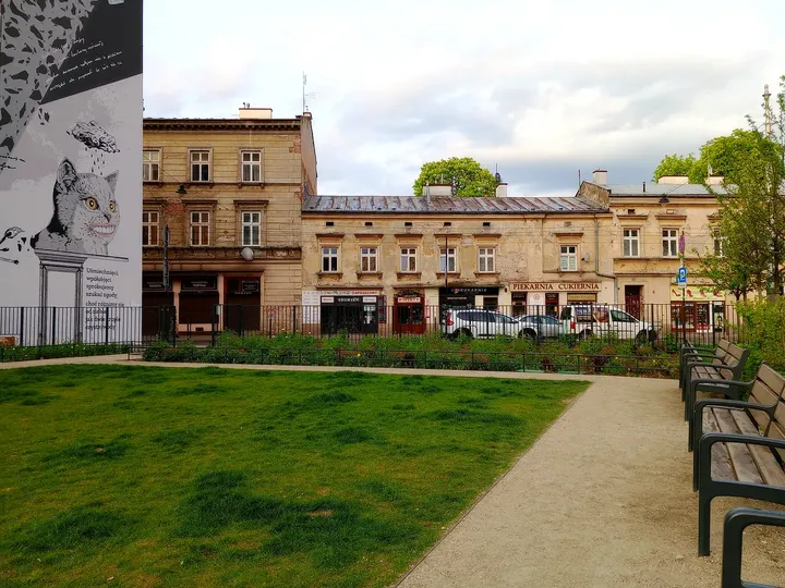 Open lawn between the buildings at Wisława Szymborska Park