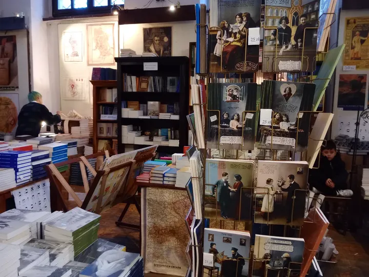 Tables and shelves inside the shop at Wolf Popper Synagogue and Austeria