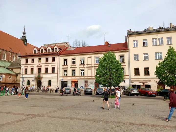 The paved square beside the older houses at Wolnica Square