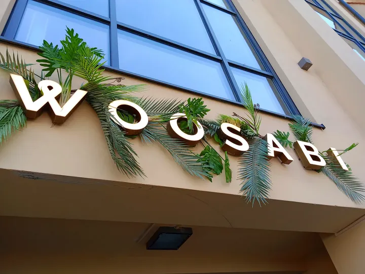 Restaurant name below the windows at Woosabi